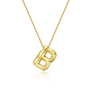 Detailed view of polished 18K gold letter B balloon pendant on a minimalist chain