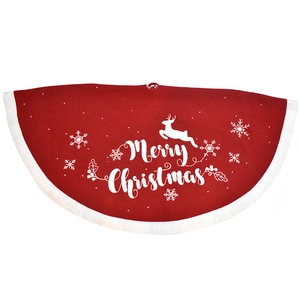 Detail of red Christmas tree skirt with plush trim, reindeer and snowflake patterns