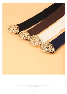 Detail of four colorful elastic belts with ornate golden heart and pear-shaped buckles