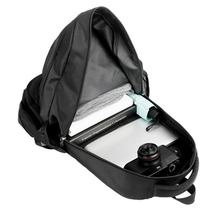 Top view of open black Oxford cloth backpack showing spacious main compartment and storage