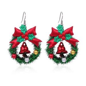 Creative Christmas wreath earrings with red bows and bells on a pure white background