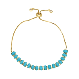Adjustable gold chain bracelet with blue oval zircon stones and slider clasp design
