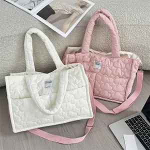 Quilted cloud shoulder bag in white and pink with heart patterns and soft texture