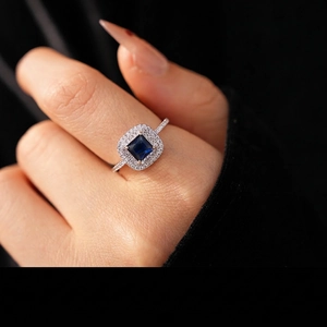Luxe silver square blue zircon ring with double halo diamond setting on hand