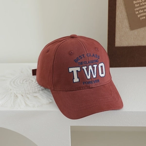Close-up of premium dark red cotton baseball cap with 3D TOW letter embroidery details