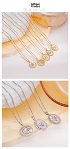 Detail of 18K gold and silver necklaces featuring mother-of-pearl bear and star pendants