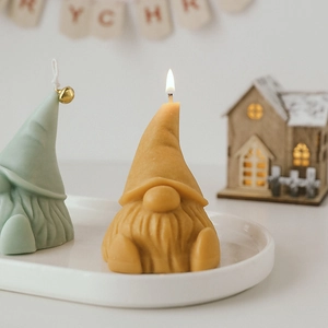 Handmade Santa Gnome scented candles in yellow and green for Christmas home decor