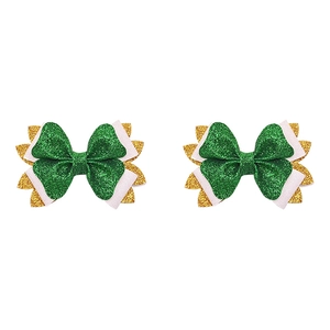 Detail of St. Patrick's glitter bow hair clips with green and pink sequin fabric