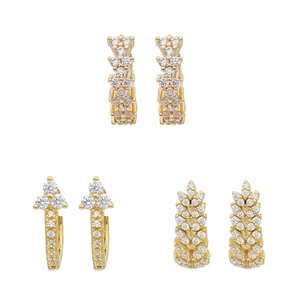Detail view of 18K gold plated copper earrings with zircon clover and wheat motifs