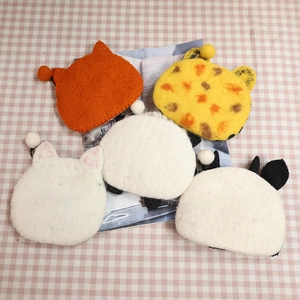 Five assorted wool felt animal coin purses including fox and panda with metal hooks