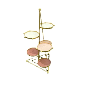 Golden multi-tier jewelry display stand with six colorful velvet trays for rings and earrings