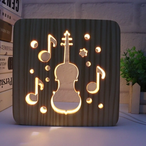 3D wooden night light with carved violin and musical notes featuring warm LED glow
