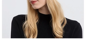 Detail showing the fine ribbed texture and high neck design of this black knit top