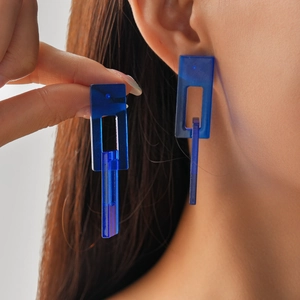 Blue acrylic geometric drop earrings with translucent rectangular links on female model