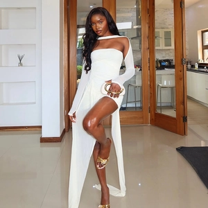 Detail of white off-shoulder long sleeve dress with irregular hem and elegant long train