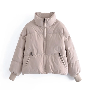 Women's beige short puffer jacket with stand collar and horizontal quilting