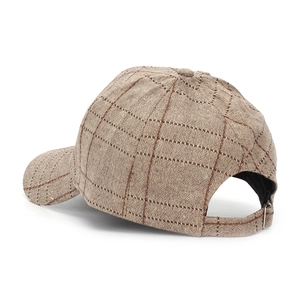 Detailed view of the back adjustable metal buckle and vintage plaid fabric of the baseball cap