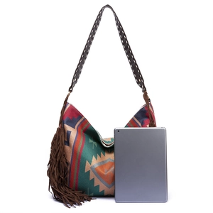 Bohemian shoulder bag detail with geometric jacquard pattern and long brown tassels