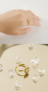 Detail of adjustable 18K gold plated ring with a sparkling heart-shaped zircon stone