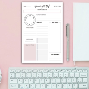 Minimalist daily planner sheet with hourly schedule, habit tracker and pink color blocks