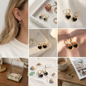 Detailed views of double-sided black heart hoop earrings in gold plated stainless steel