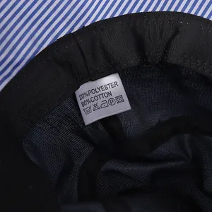 Detail of the striped sun hat interior showing black mesh lining and fabric label