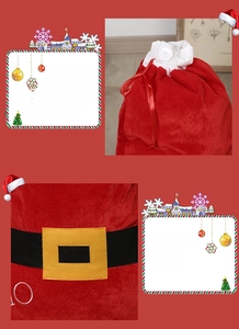 Detail of red velvet Christmas gift sack with Santa belt buckle and drawstring closure