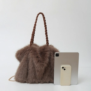 Furry brown tote bag with woven handles next to a tablet and phone for size reference