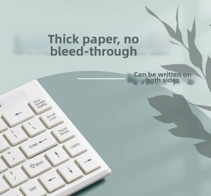 Close-up of white mechanical keyboard keys with black lettering in a minimalist setup