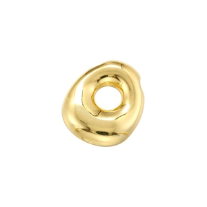 Macro detail of glossy golden irregular bubble letter bead with smooth metallic texture