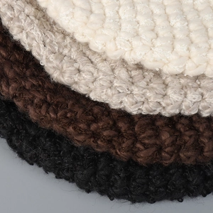 Handmade chunky knit beanie in beige, grey, coffee, and black tones with retro texture