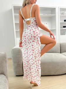 Detail of white floral mesh nightgown with red prints, ruffle edges and side slit design
