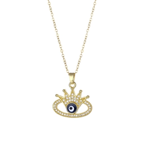 Golden crown evil eye necklace with blue zircon crystal pendant on white background