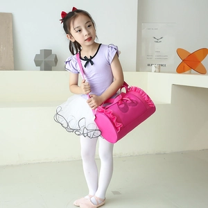 Pink cylindrical ballet dance bag for girls with lace trim and pointe shoe print