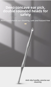 Close-up of double-headed stainless steel ear pick with non-slip grip on grey background