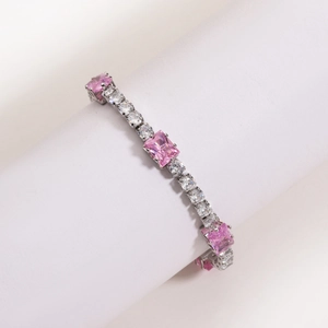 Detail of silver chain bracelet with square cut pink and white zirconia stones