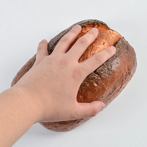 Detailed view of oversized soft PU simulated bread showing realistic texture and slow rebound