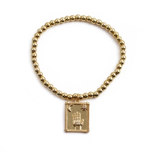 Golden beaded bracelet with rectangular palm pendant featuring moon and evil eye motifs