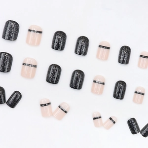 Short square press-on nails featuring glittery black finish and nude pink striped designs