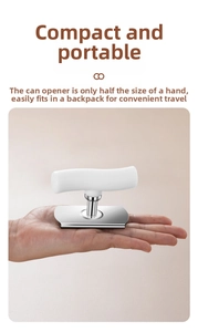 Close-up of a compact manual stainless steel bottle opener held in one hand for scale