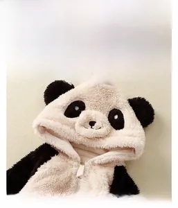 Detail of plush baby panda onesie showing soft fleece texture and cute hood ears