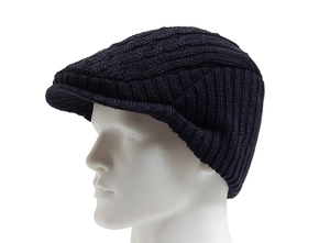 Detailed view of dark blue cable knit pattern and texture on men's thermal beret hat