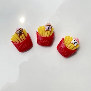 Macro shot of 3D resin bear fries accessories for DIY phone cases in multiple colors