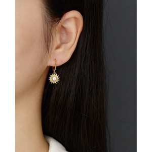 Bohemian gold S925 silver sunburst hoop earrings with sparkling zircon gemstone on model