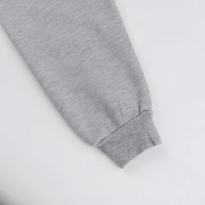 Close-up of grey ribbed cuffs on cotton blend hoodie with soft brushed texture detail