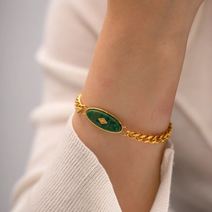 Bohemian gold plated titanium steel bracelet with green oval African jade on wrist