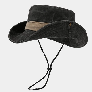 Detailed view of washed vintage bucket hat with brown belt trim and metal side snaps