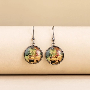 Detail of artistic round drop earrings featuring Klimt's The Kiss oil painting style