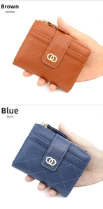 Detail of blue and brown quilted leather wallets showing card slots and gold ring buckles