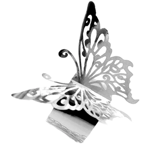 Detail of laser-cut silver butterfly napkin ring with 3D wings and reflective finish